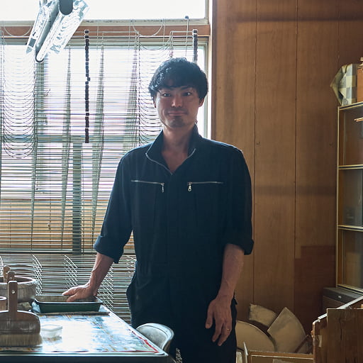 米原康人